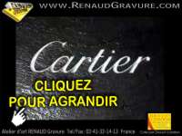 Gravure des logos cartier dans de l'ardoise naturelle